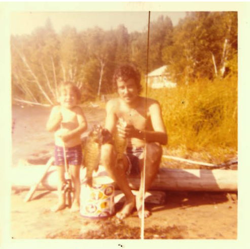 Father and son fishing at the family lake — a summer memory